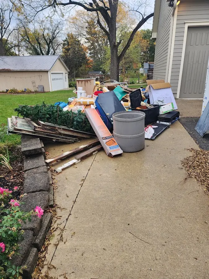 Dumpster being loaded with debris for 3 Yard Dumpster Rental in Montevideo